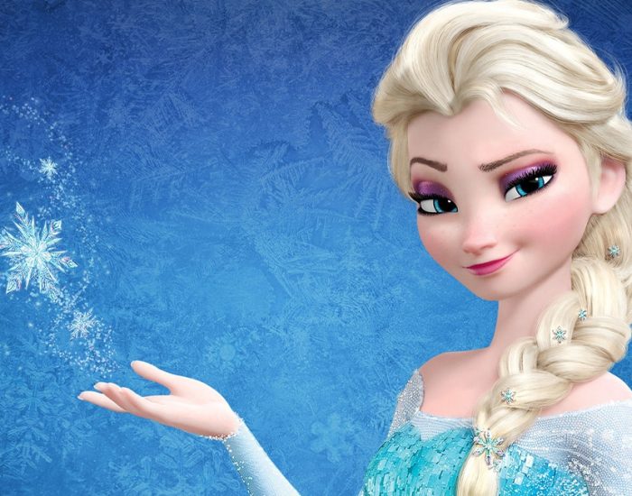 Elsa smiling with snow and ice around her
